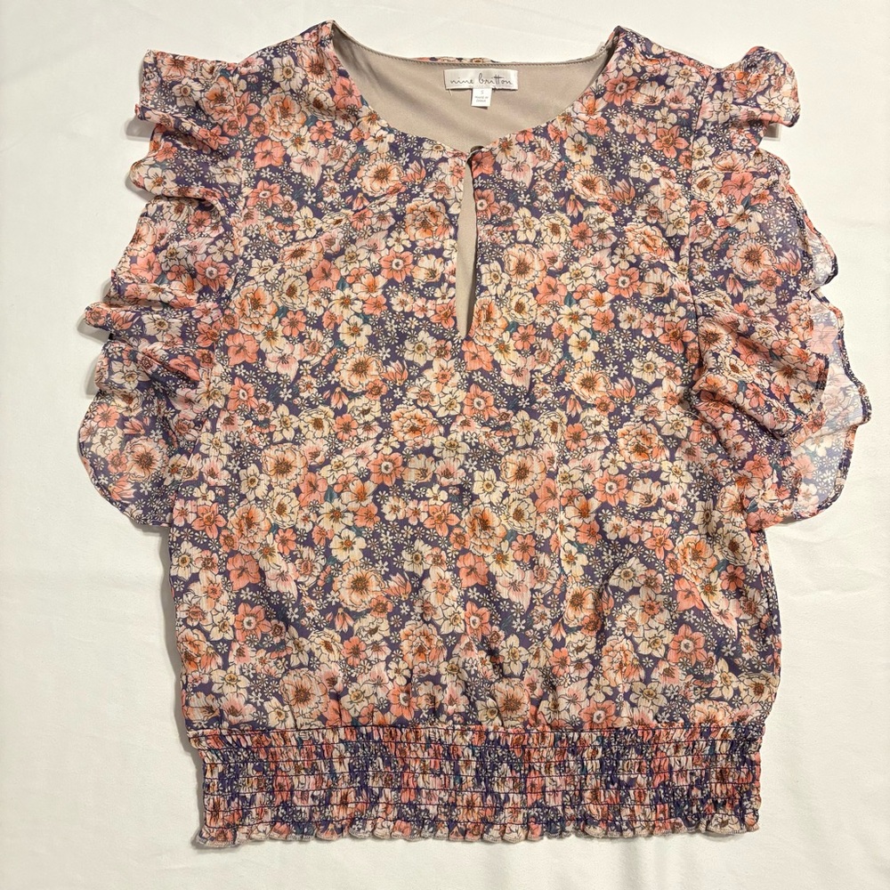 Nine Britton blouse in a floral print top featuring flutter sleeves-keyhole neck